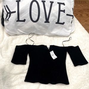 Brand new with Tags black shirt. Says size Large but it fits a Medium.